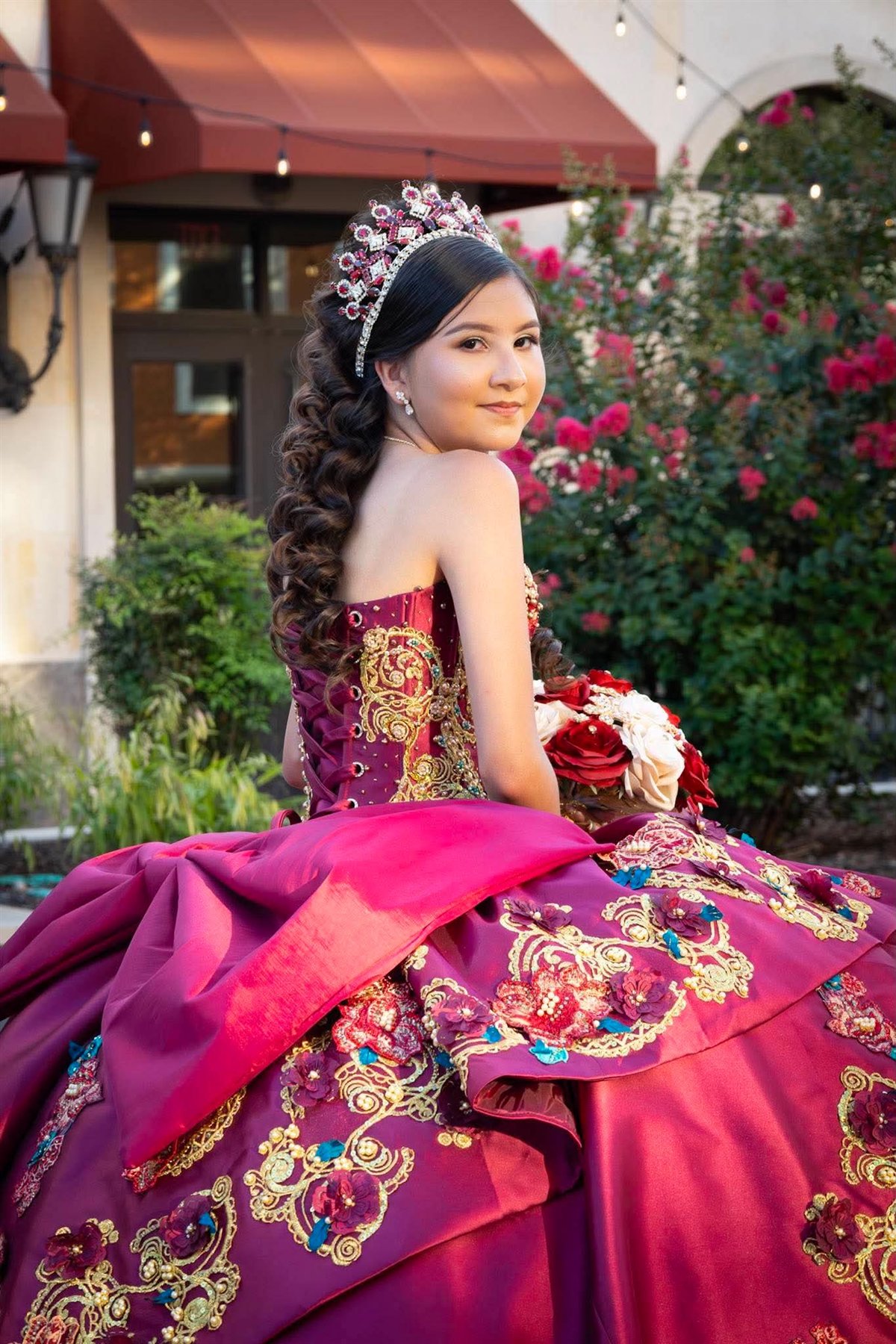Quinceañera portrait in a burgundy gown
