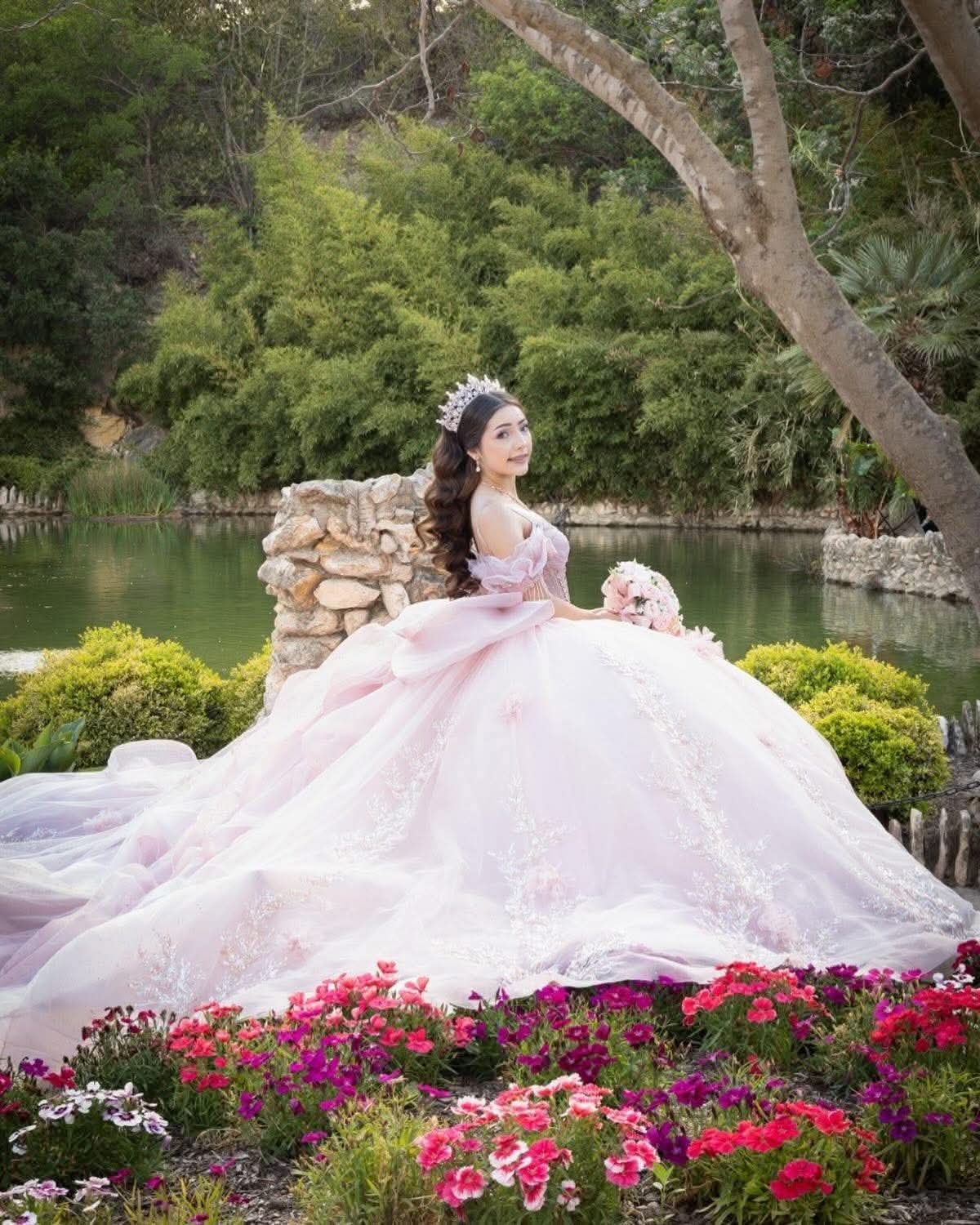 Quinceañera portrait with a burgundy bouquet