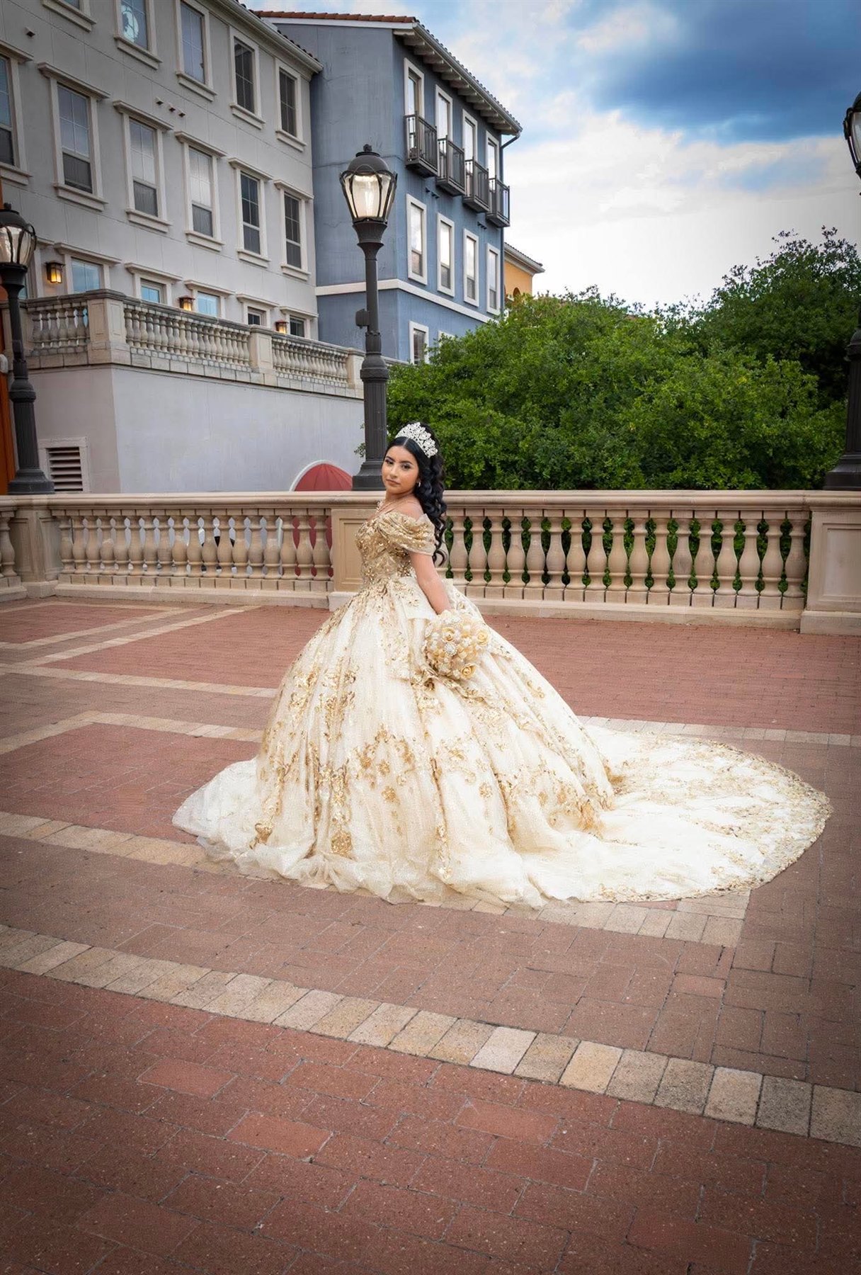 Gold gown quinceañera makeup and hair portrait